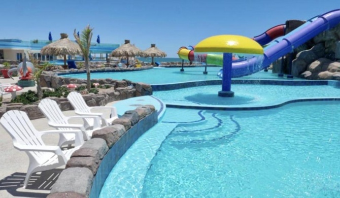 Gorgeous Beachfront Gem with Water Slides